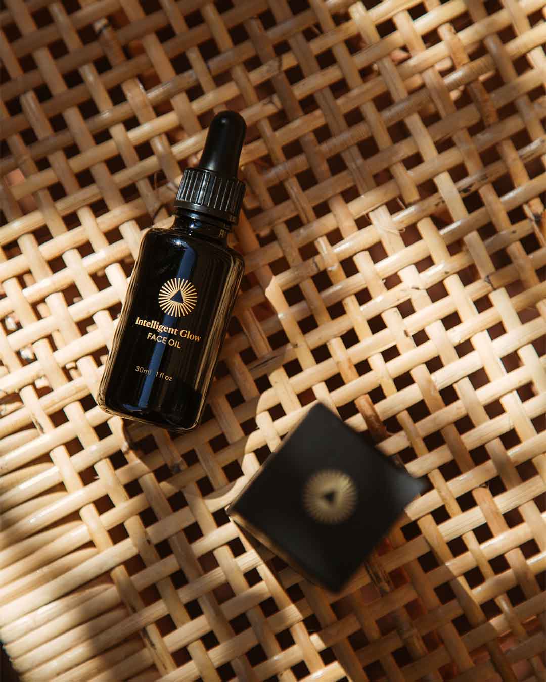 Intelligent Change Intelligent Glow Face Oil 10ml bottle, clear glass container with dropper for skincare routine.