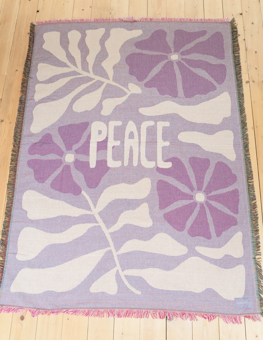 Elevated Faith Peace throw blanket with soft fabric and peaceful design, perfect for cozying up on a sofa or bed.