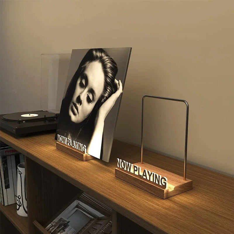 Wooden vinyl record stand by eprolo holding a vinyl album, desktop display for office decor or music collection organization