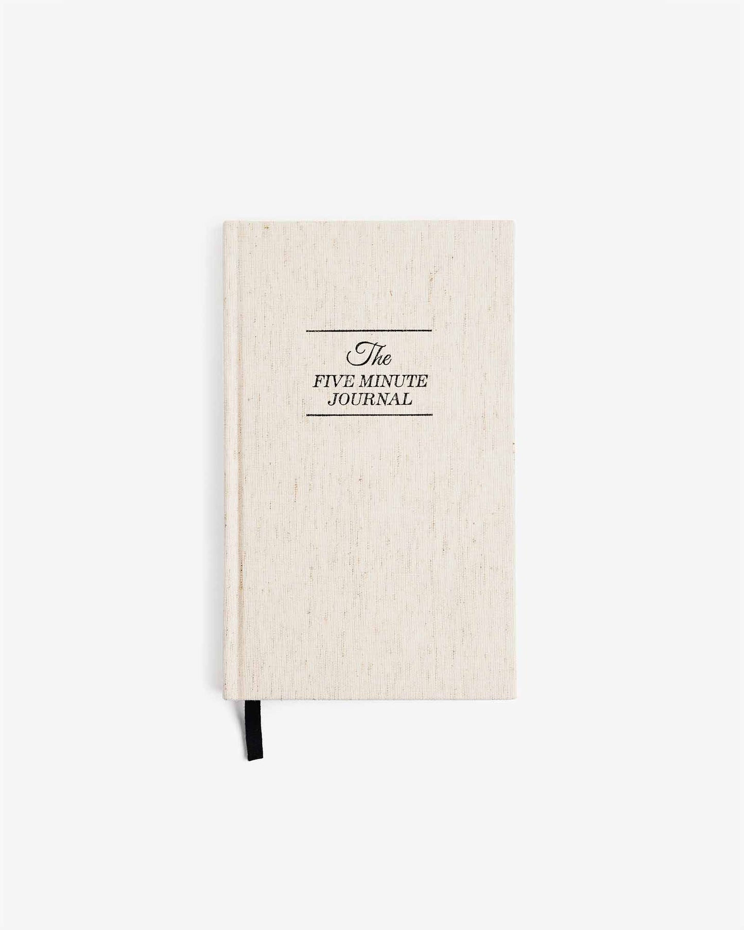 The Five Minute Journal in linen, a mindfulness journal by Intelligent Change, with open pages showing daily prompts.