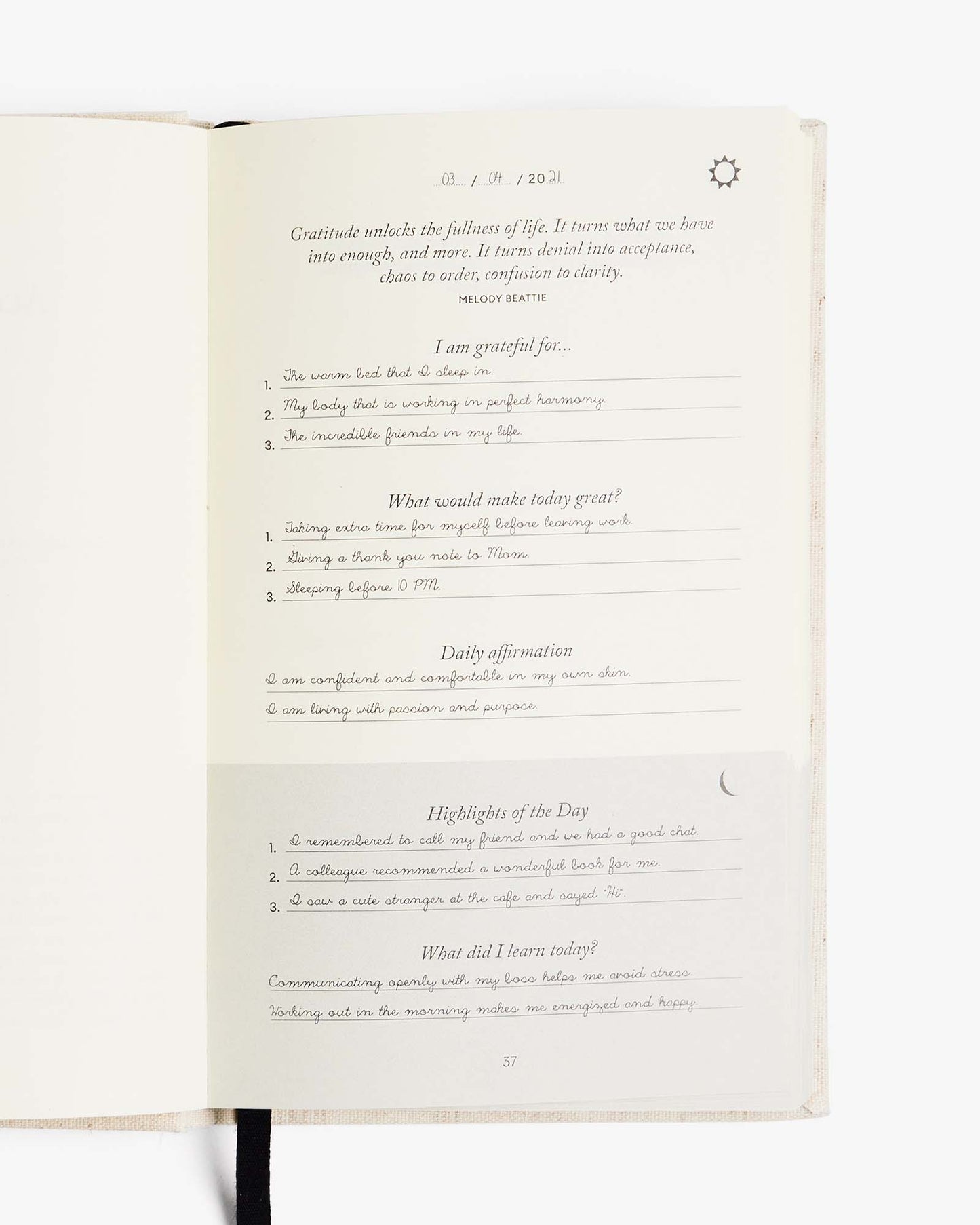 The Five Minute Journal original linen mindfulness journal with a textured cover and gold foil lettering on the front.