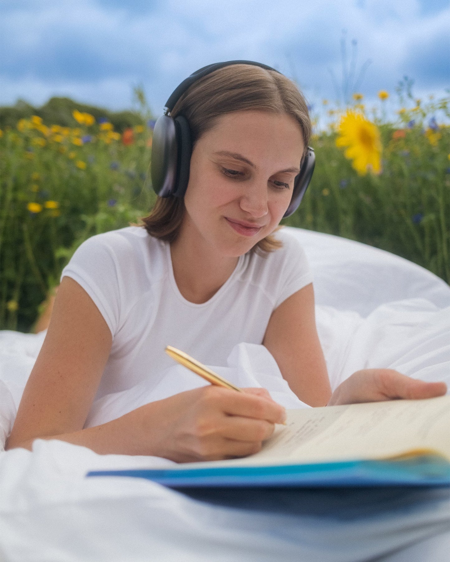 A Calm x The Five Minute Journal mindfulness journal by Intelligent Change, with a soft cover and open pages for daily reflections.