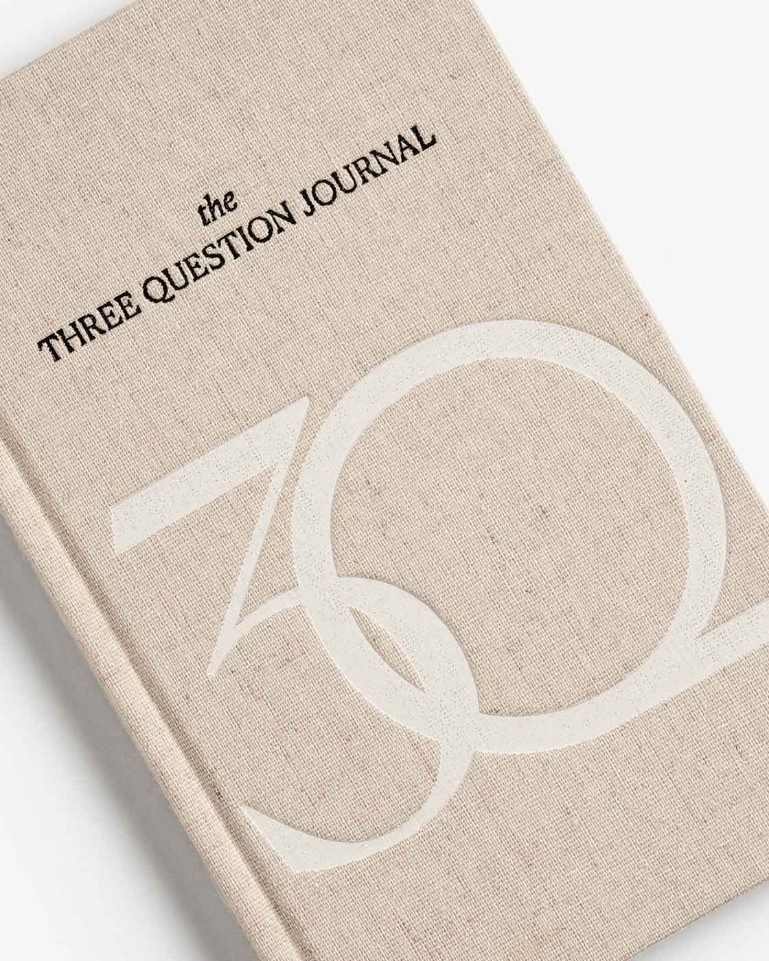 Mindfulness journal by Intelligent Change titled "The Three Question Journal - Exclusive" with a clean, minimalist cover design.