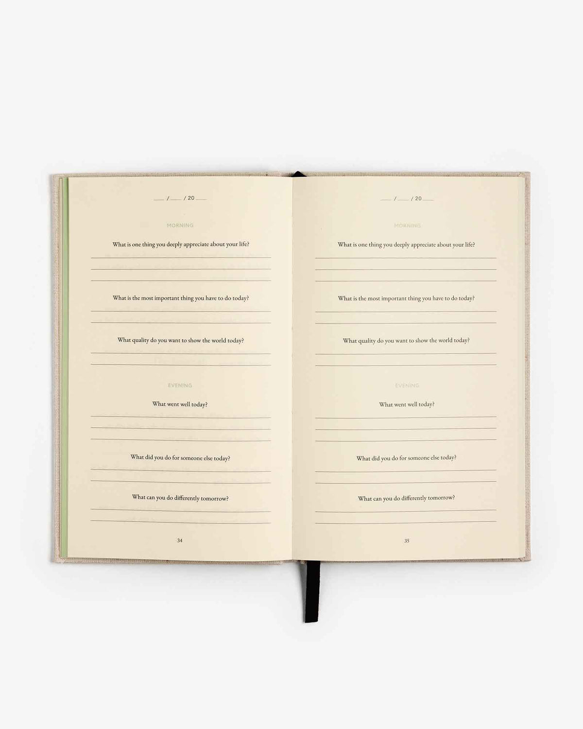 The Three Question Journal by Intelligent Change, a mindfulness journal with prompts for self-reflection and personal growth.