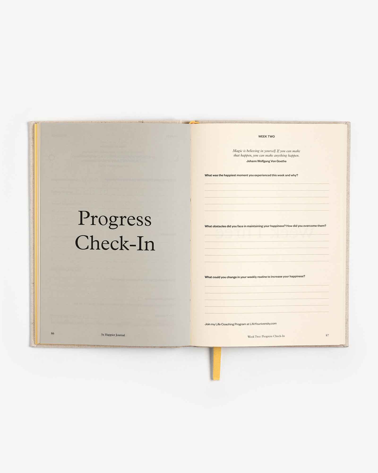 Open 3x Happier Journal by Intelligent Change with pages for daily reflections and gratitude in a sleek, minimalist design.