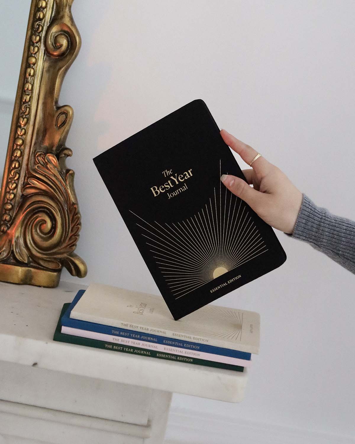 Black Best Year Journal Essential from Intelligent Change, a mindfulness journal featuring a sleek cover and inspiring interior pages.
