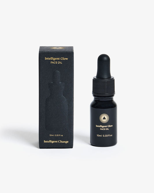 Bottle of Intelligent Glow Face Oil 10ml from Intelligent Change, with a sleek label and clear dropper cap.