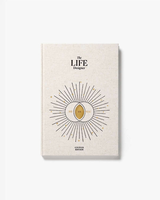 Intelligent Change Life Designer Journal for Couples with a hardcover and open pages for planning and reflection.