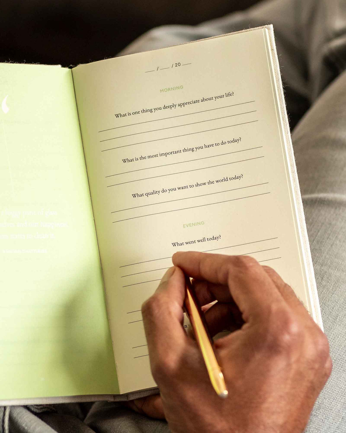 Close-up of "The Three Question Journal" by Intelligent Change, a mindfulness journal with a minimalist cover design.