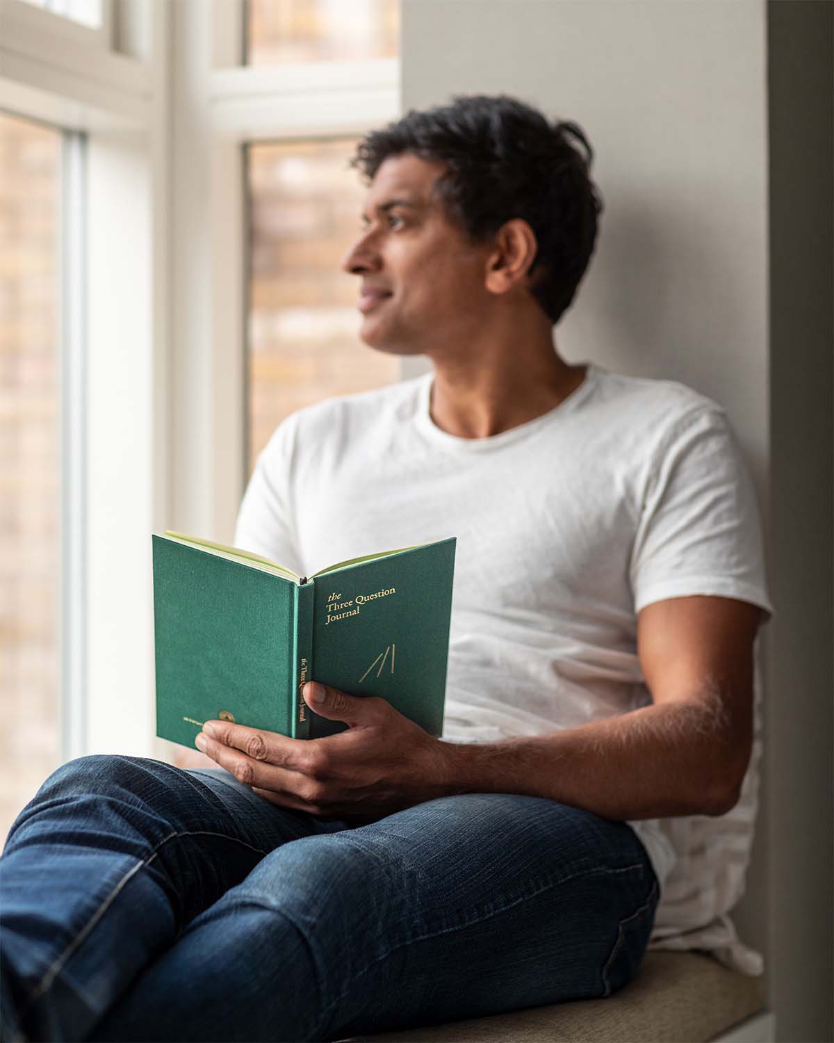 Green The Three Question Journal by Intelligent Change for mindfulness, featuring a soft cover and minimalist design.