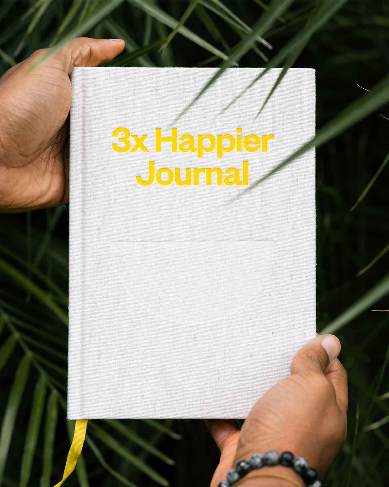 Three Happier Journals by Intelligent Change, featuring sleek covers and lined pages for daily reflection and gratitude.