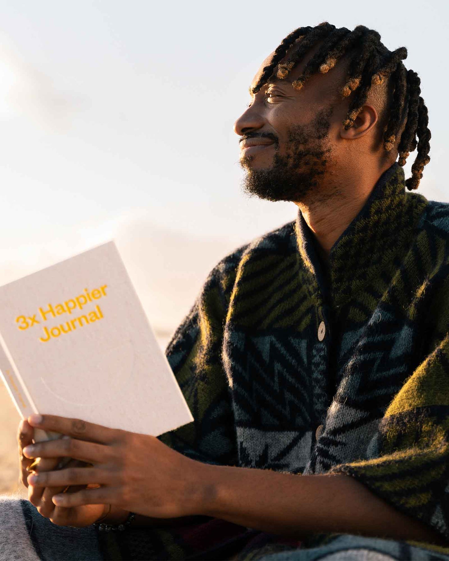 Close-up of the Intelligent Change 3x Happier Journal with a minimalist cover and lined pages for daily reflection and gratitude.