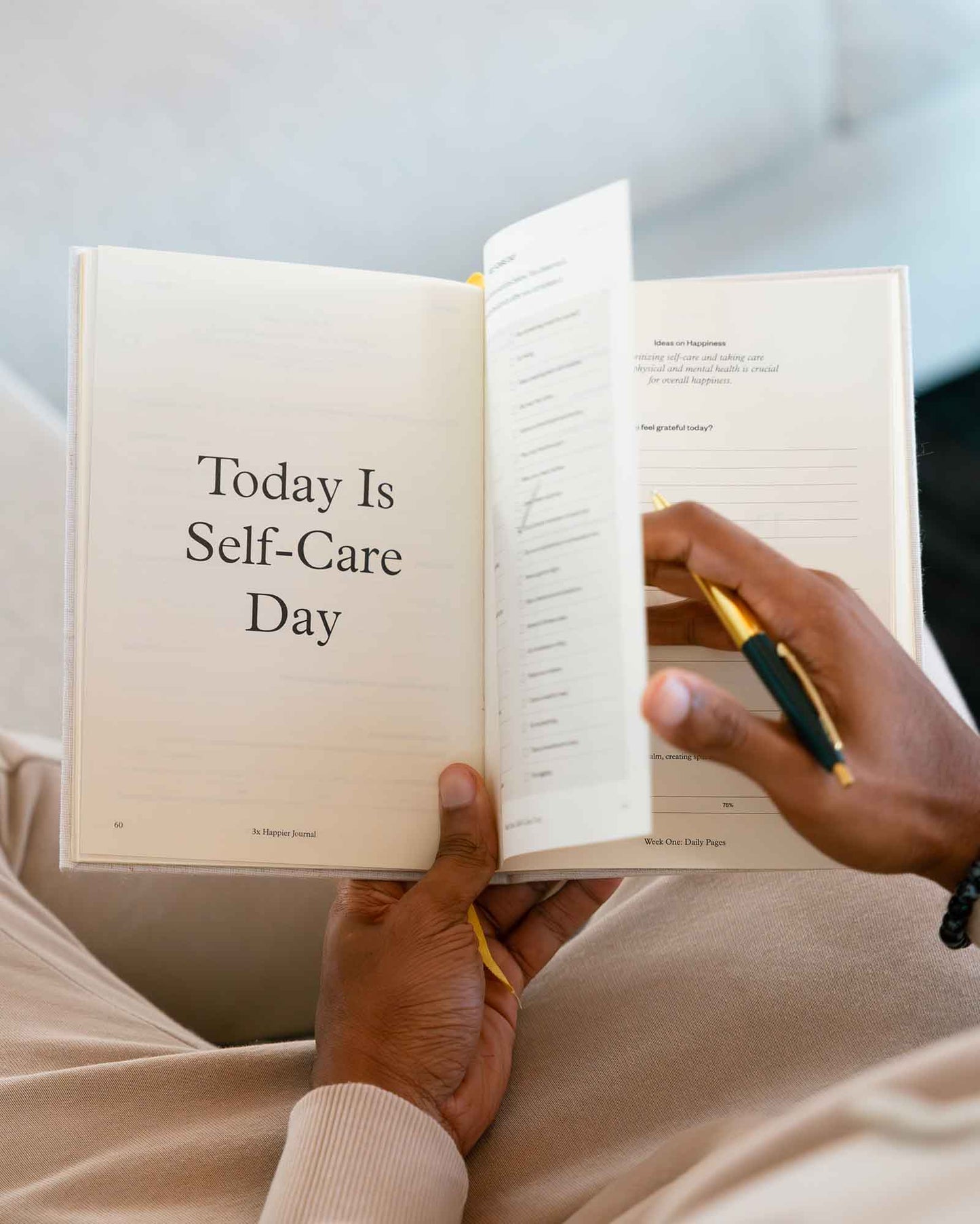 Open 3x Happier Journal by Intelligent Change showing lined pages and colorful cover for daily reflection and gratitude.