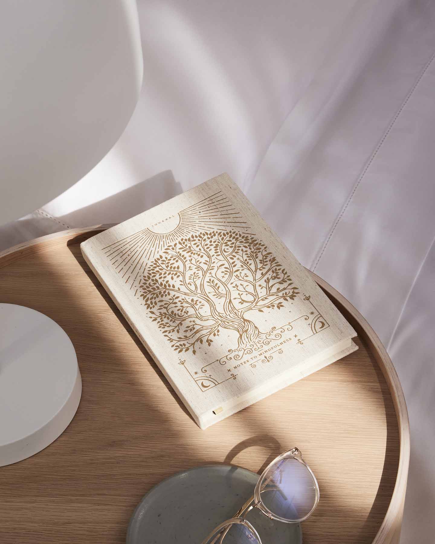 Linen Notes to Mindfulness Journal by Intelligent Change featuring a soft cover and pages for mindfulness practice and reflection.