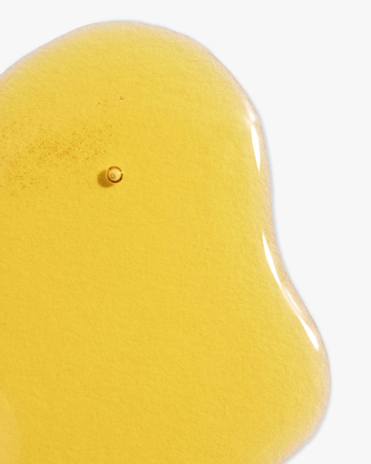 Intelligent Change Intelligent Glow Face Oil 10ml in a clear glass bottle with dropper, displayed on a neutral background.