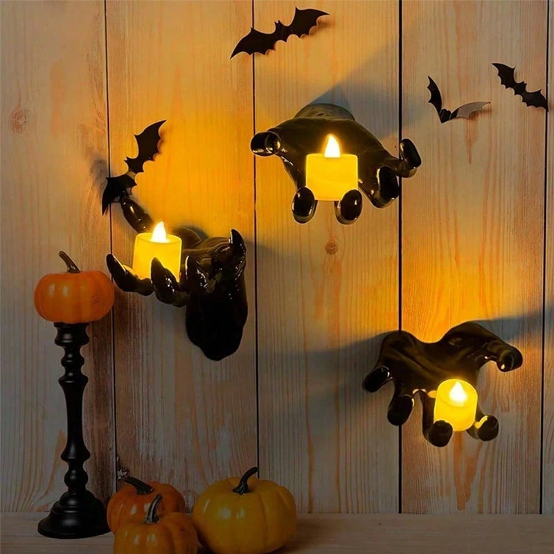 Gothic Halloween indoor decor with 12 bat sticker wall hangings featuring spooky hands and lit candles for eerie wall decorations.