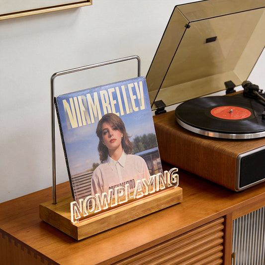 Wooden vinyl record stand by eprolo showing a record on a desktop display for office decor and album organization.