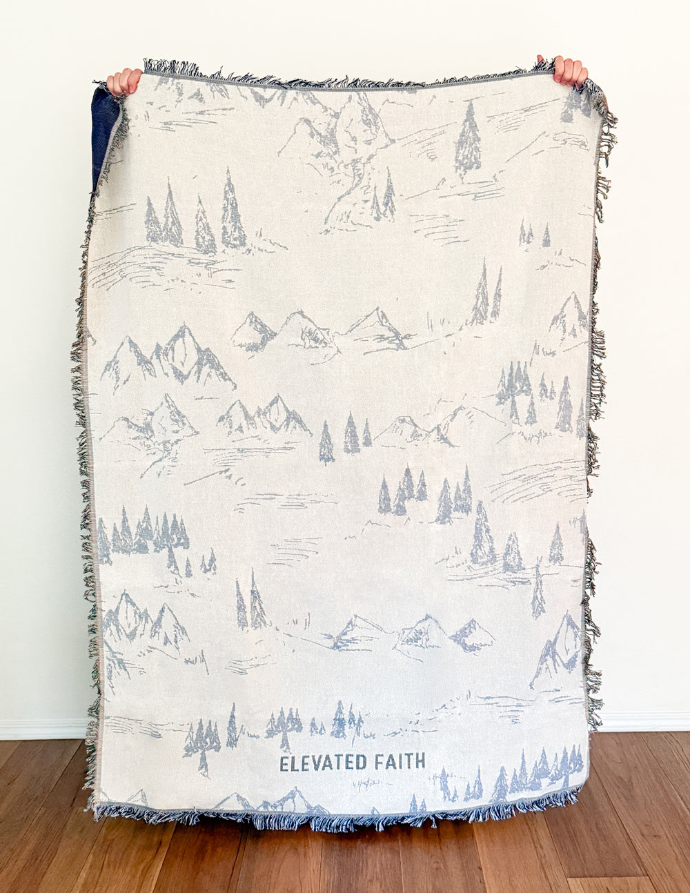 Elevated Faith mountainscape throw blanket with scenic mountain design in soft, cozy fabric for warmth and decoration.