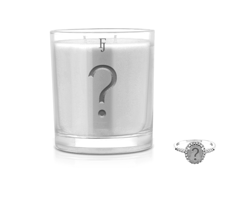 Mystery Candle With Jewelry - A Surprise Awaiting You featuring a candle and jewelry ring.